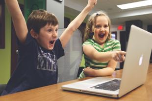 Early years and childcare - children using laptop computer