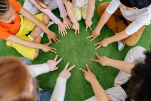 Early years and childcare - group of children sitting on carpet