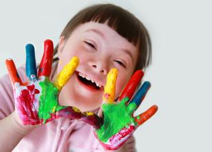 Early years and childcare - young girl with paint on her hands