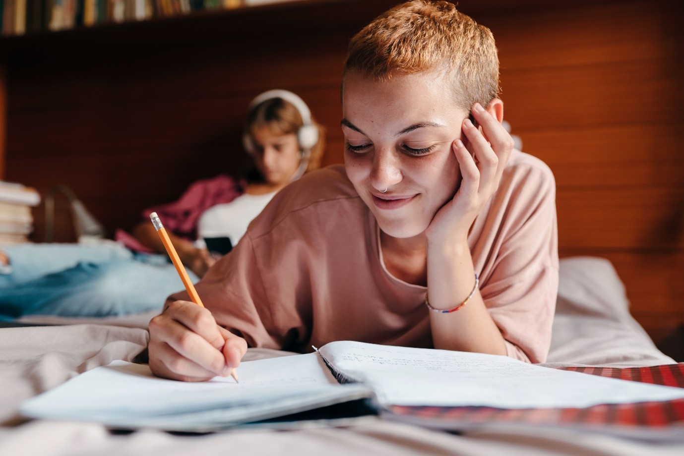 Person writing in a notepad