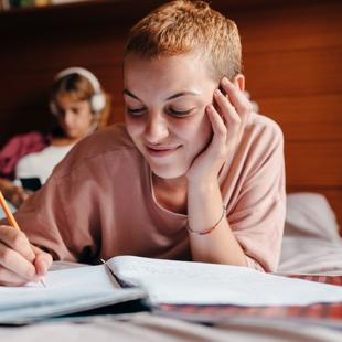 Person writing in a notepad